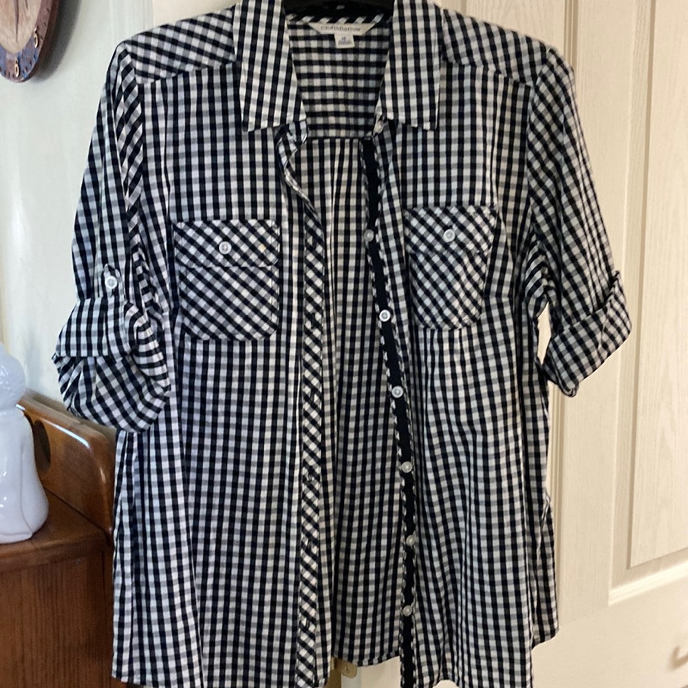 White and black shirt sleeve shirt. Roll up button sleeve